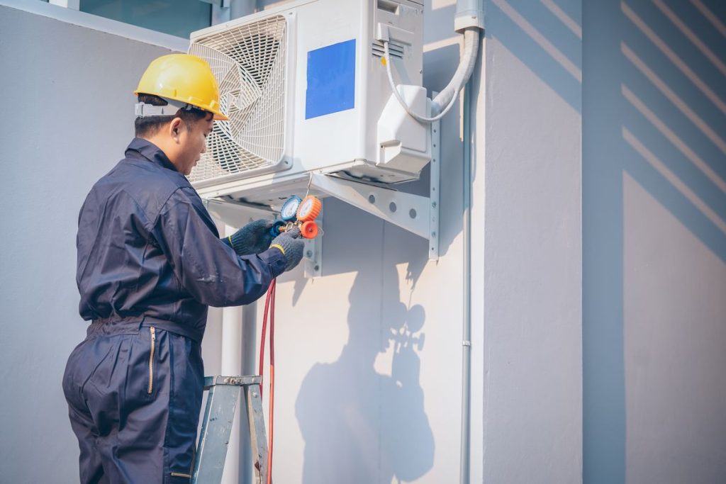 Homeowner troubleshooting an AC that is not cooling in a Western North Carolina home