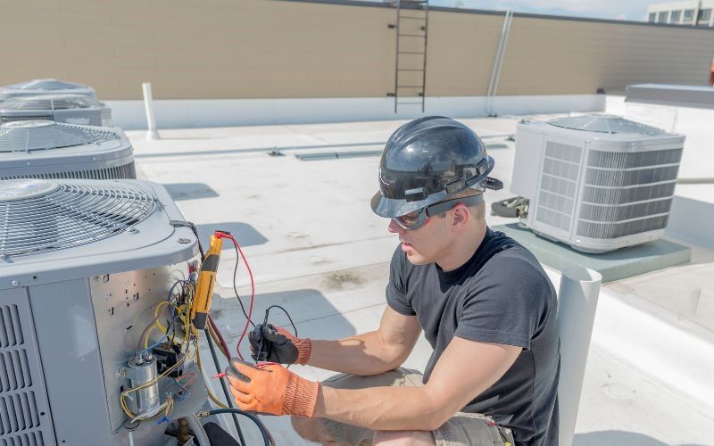 Comfort Pros HVAC technician servicing a home in Brevard, NC